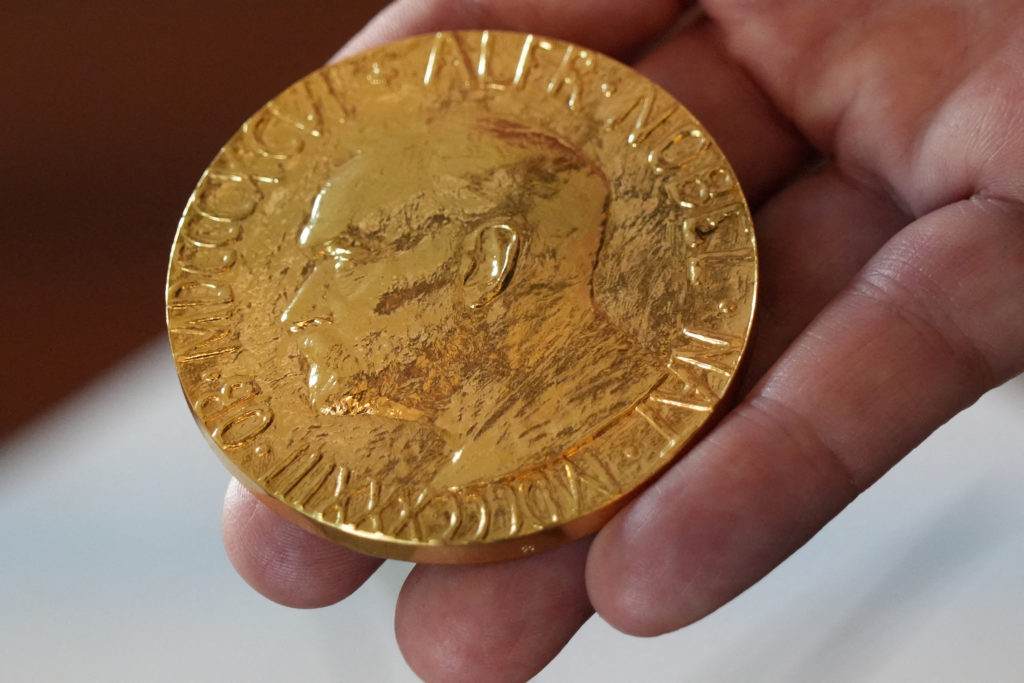FILE PHOTO: An employee of the Norwegian Nobel Institute holds a replica of a Nobel Peace Medal in the Institute in Oslo
