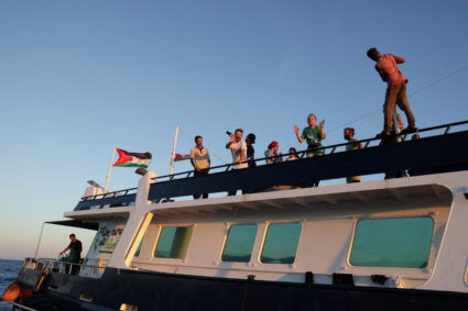 Activists on Gaza-bound aid flotilla say Israeli navy has begun intercepting their vessels