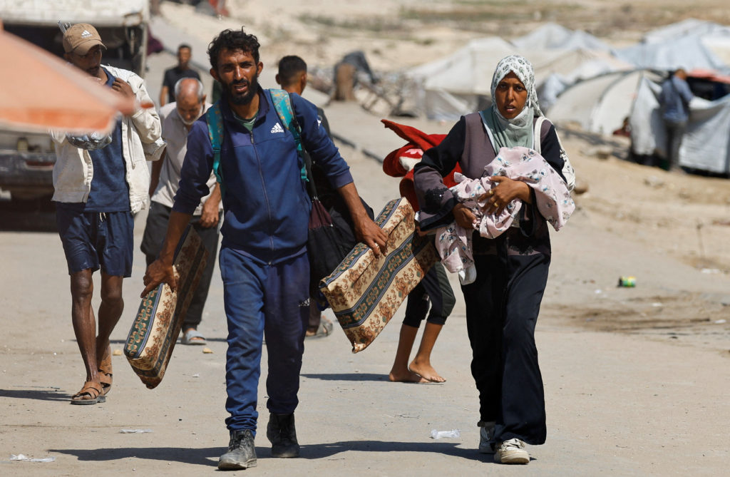 Displaced Palestinians fleeing northern Gaza head south, in the central Gaza Strip