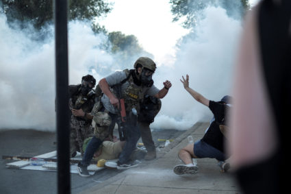 People protest during a standoff with ICE and federal officers in Chicago