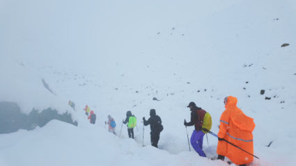 A screen capture from video shows trekkers leaving their campsite, as unusually heavy snow and rainfall pummeled the Himal...