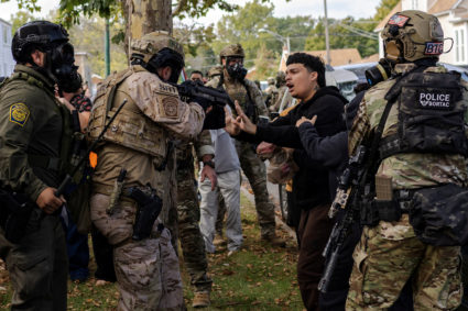 Police clash with community members after detaining a man on Chicago's South Side