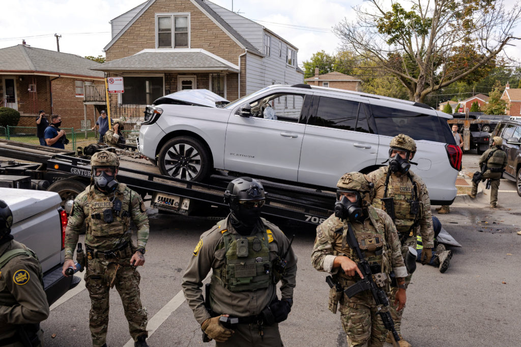 Police clash with community members after detaining a man on Chicago's South Side