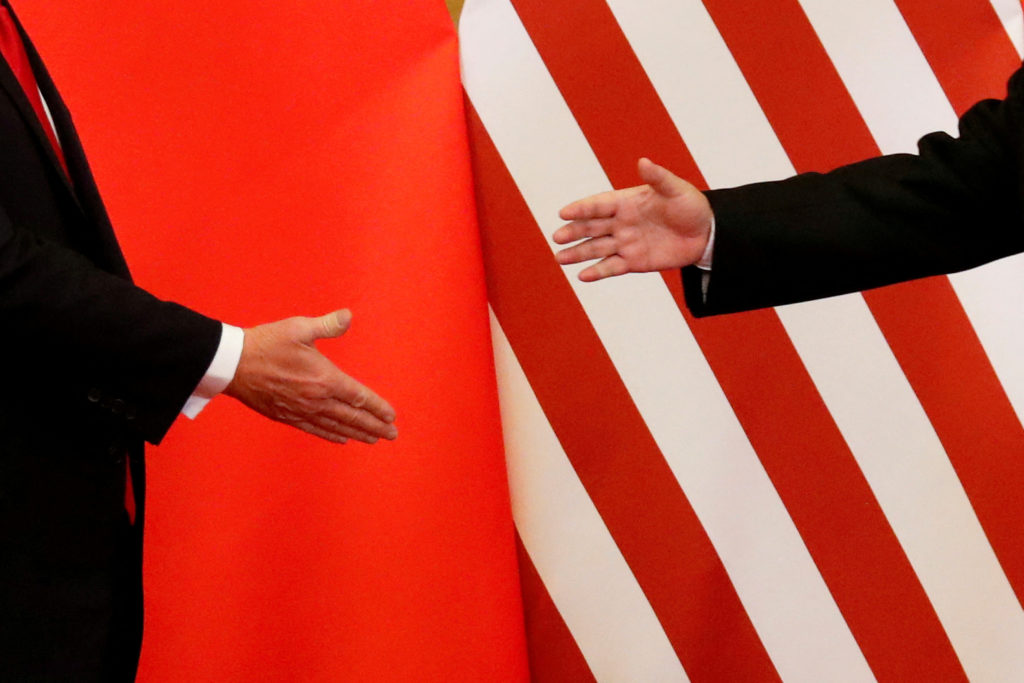FILE PHOTO: U.S. President Donald Trump and China's President Xi Jinping shake hands