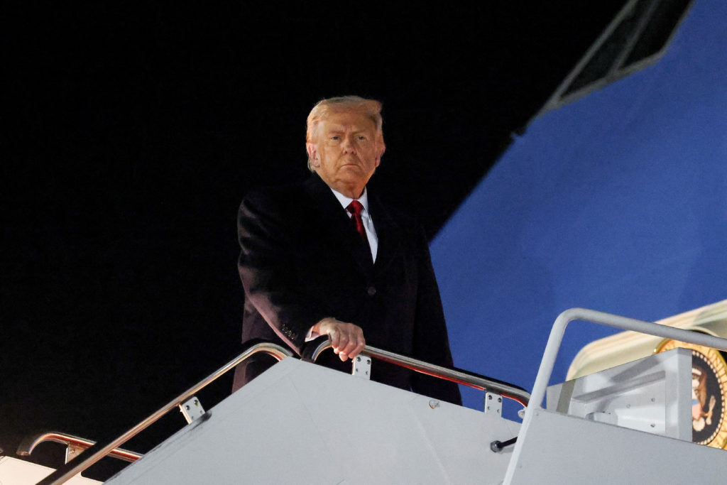 U.S. President Donald Trump boards Air Force One as he departs for Asia, at Joint Base Andrews