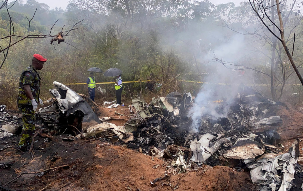 Security officials secure the wreckage of the aircraft 5Y-CCA operated by Mombasa Air Services, which crashed in Kwale County