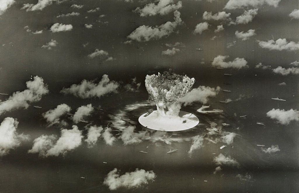 FILE PHOTO: Handout of a mushroom cloud rises with ships below during Operation Crossroads nuclear weapons test on Bikini ...