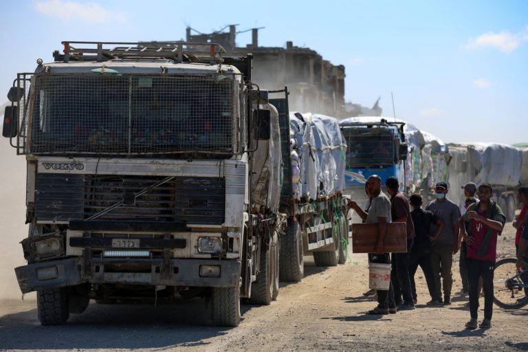 Trucks carry aid for Palestinians in Khan Younis