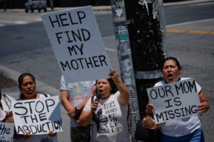 Family and community members protest in support of a missing migrant mother, in Los Angeles