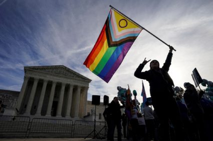 FILE PHOTO: Activists gather outside U.S. Supreme Court as justices hear arguments in case involving LGBT rights in Washin...