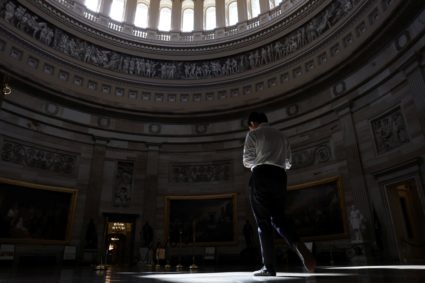 A man walks through the empty U.S. Capitol rotunda in Washington