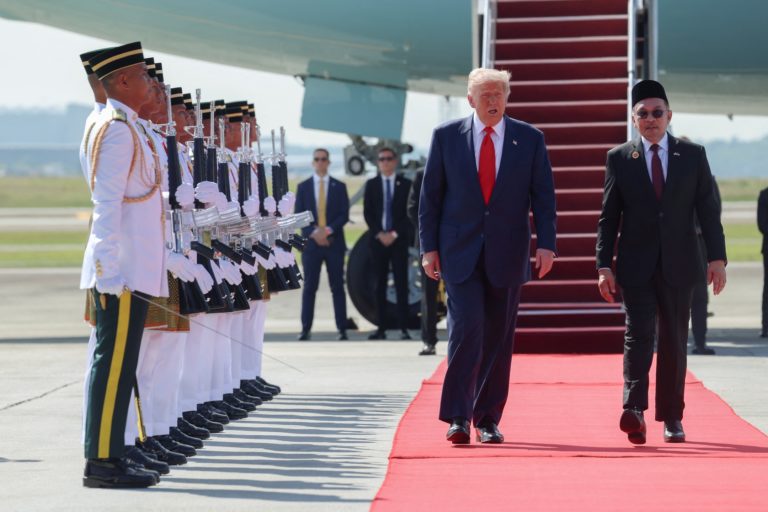 Malaysian Prime Minister Anwar Ibrahim welcomes U.S. President Donald Trump at Kuala Lumpur International Airport