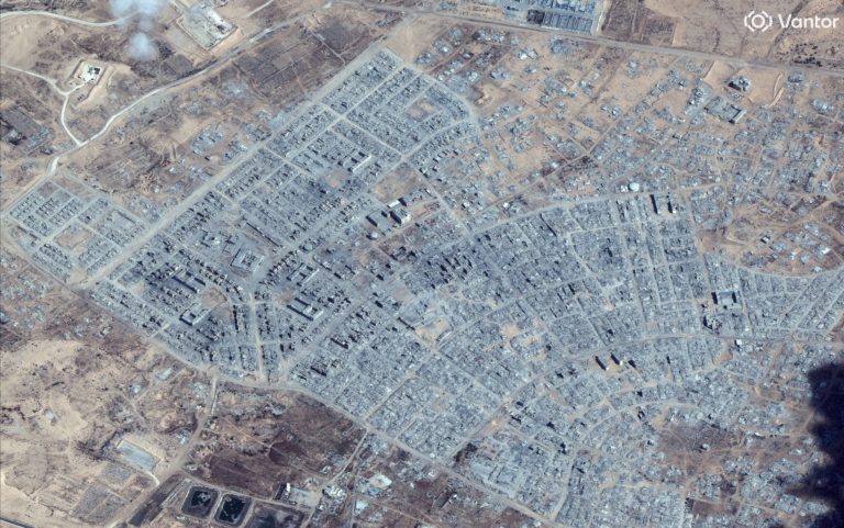 A satellite image shows an overview of destroyed buildings in Rafah