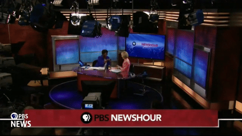 Gwen Ifill and Judy Woodruff fist bump after their first episode as co-anchors of The PBS NewsHour