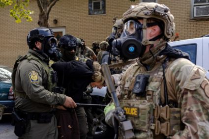 Police clash with community members after detaining a man on Chicago's South Side