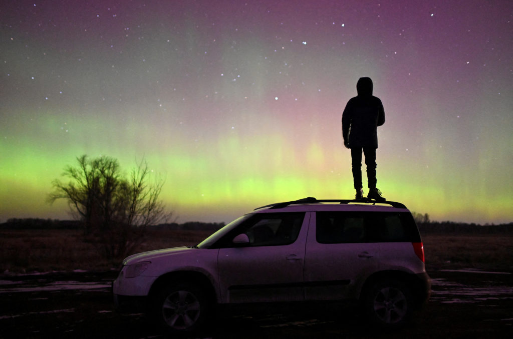 Auroras, caused by a coronal mass ejection on the Sun, illuminate the skies in Omsk region