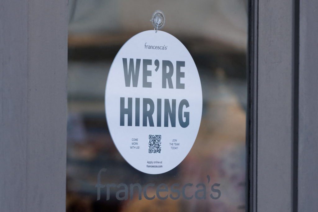 "We're hiring" sign at business in Encinitas