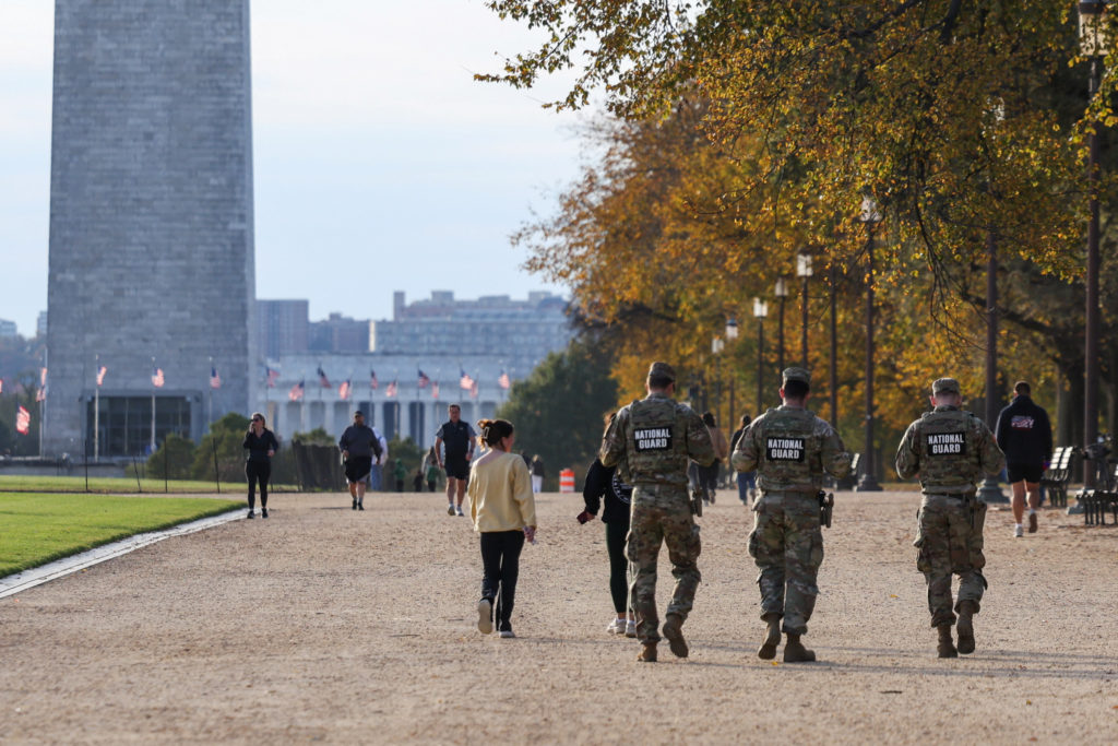 Members of the National Guard patrol the National Mall near the Washington Monument in Washington, D.C.