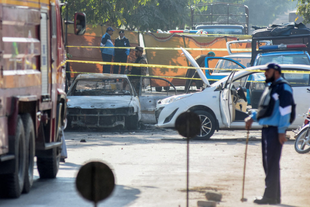 A police officer stands at the site of a blast outside a court building in Islamabad