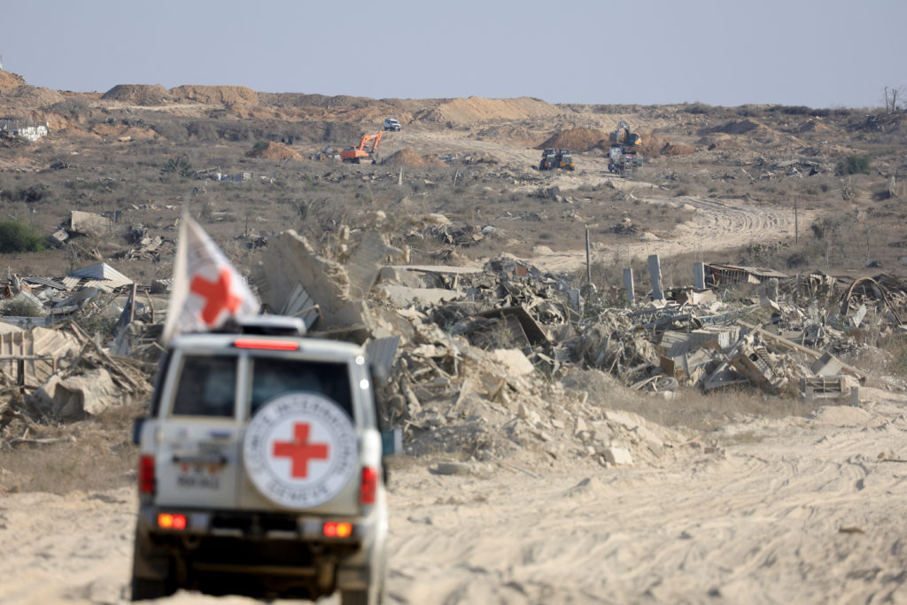 A Red Cross vehicle operates in an area within the so-called "yellow line" to which Israeli troops withdrew under the ceas...