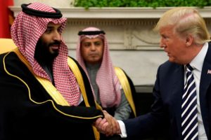FILE PHOTO: U.S. President Donald Trump shakes hands with Saudi Arabia's Crown Prince Mohammed bin Salman in the Oval Offi...
