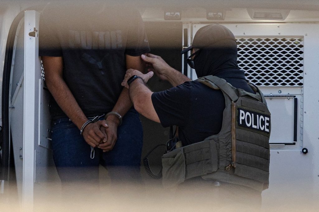 Federal agents unload detainees at the Broadview ICE detention center