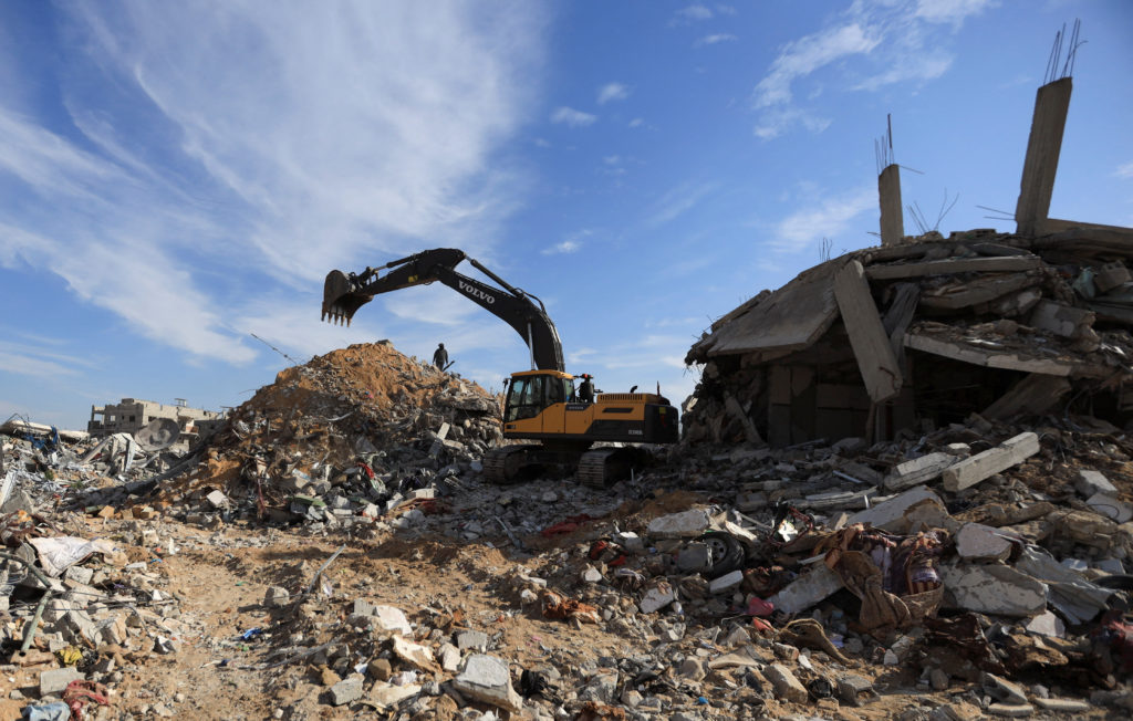 Heavy machinery operates at a site as as Hamas says it continues to search for the bodies of deceased hostages, in Beit La...
