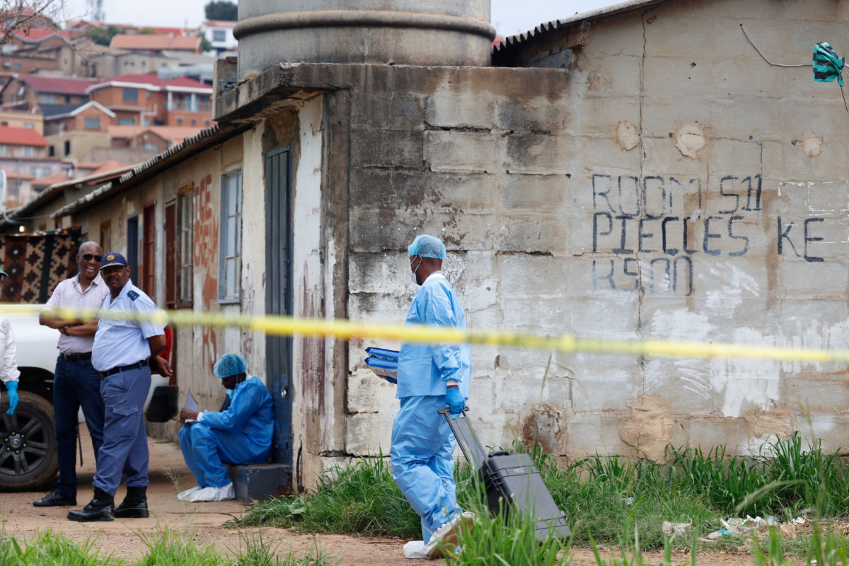 Police tape outside a home in South Africa following a mass shooting.