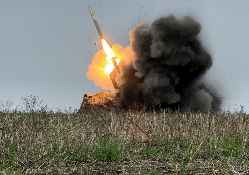 Ukrainian servicemen fire a Multiple Launch Rocket System towards Russian troops near the frontline town of Pokrovsk