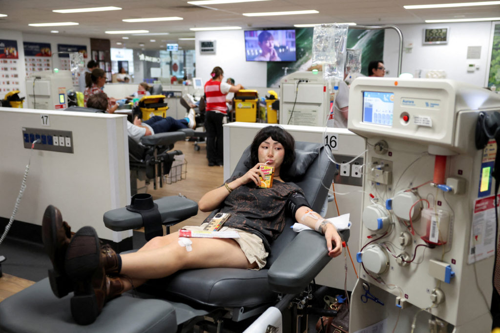 People donate blood, following a deadly shooting incident during a Jewish holiday celebration at Bondi Beach, in Sydney