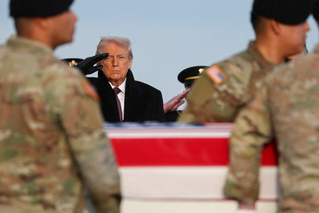 U.S. President Donald Trump participates in a dignified transfer of the remains of two Iowa National Guard members, in Dover