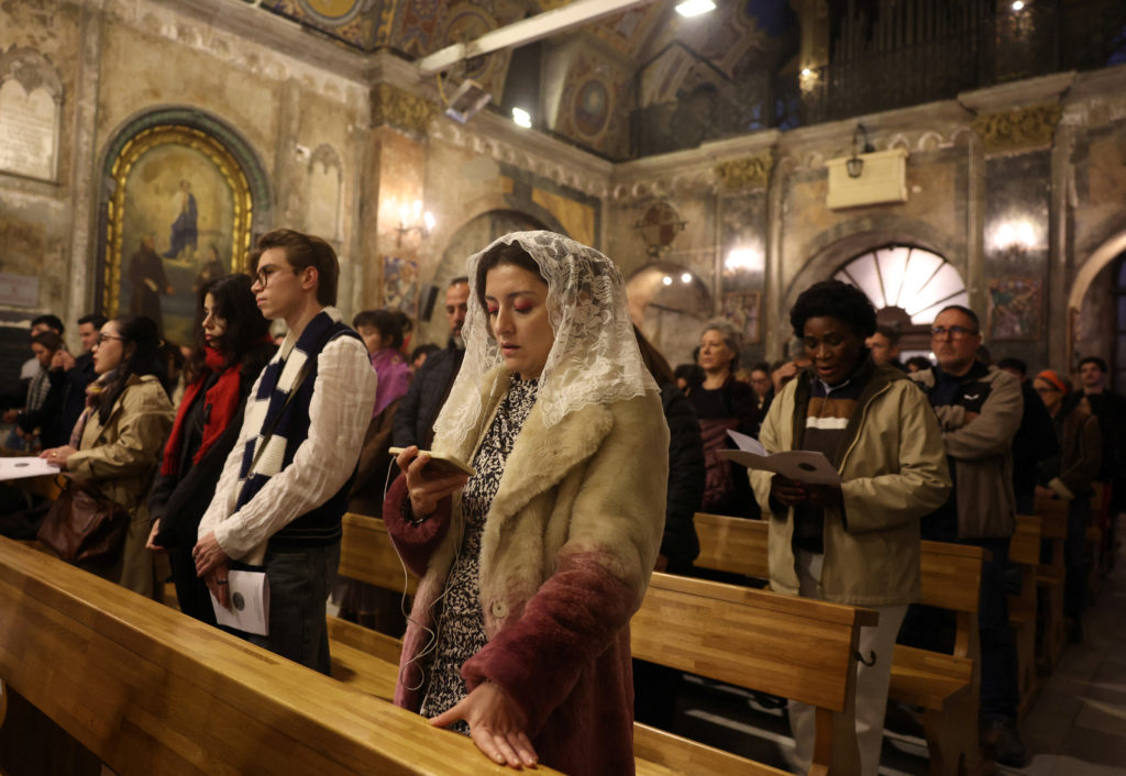 People attend a Christmas Eve service at St. Antuan Catholic church in Istanbul