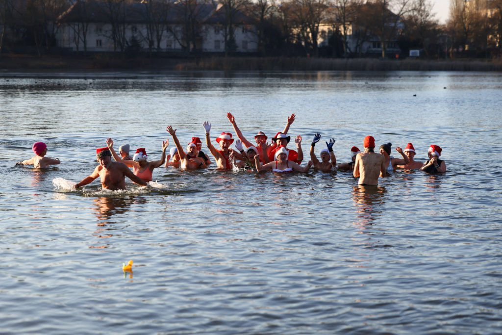 Berliner Seehunde take part in traditional Christmas Day swimming event in Berlin