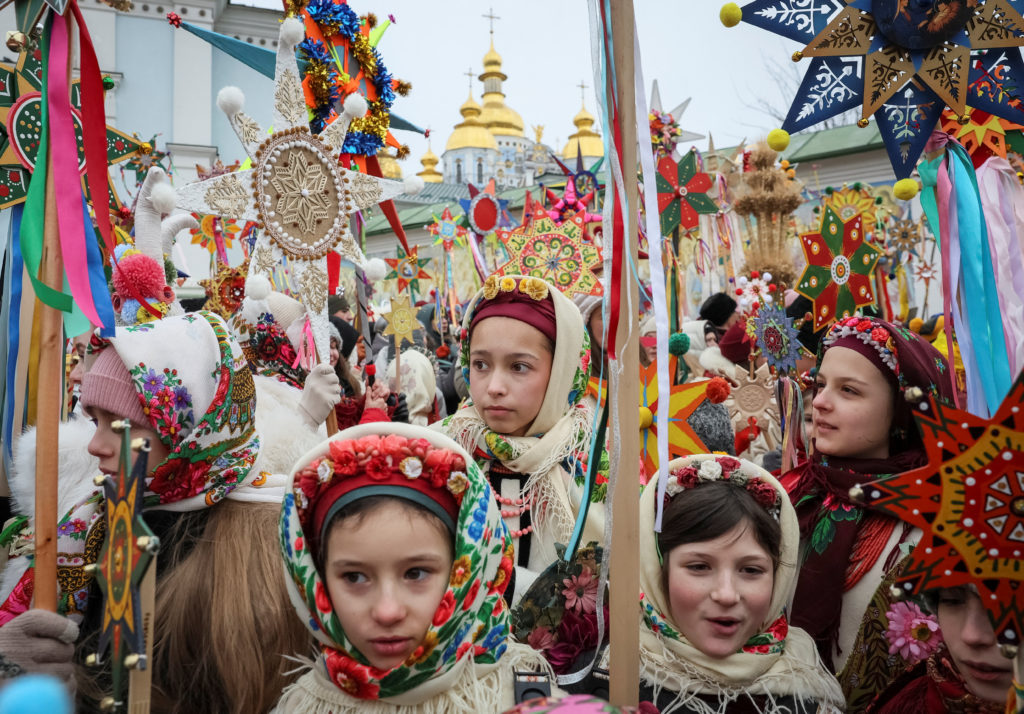 People dressed in traditional Ukrainian costumes attend Christmas celebrations in Kyiv