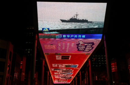 Screen showing a news report on China's military drills around Taiwan, in Beijing
