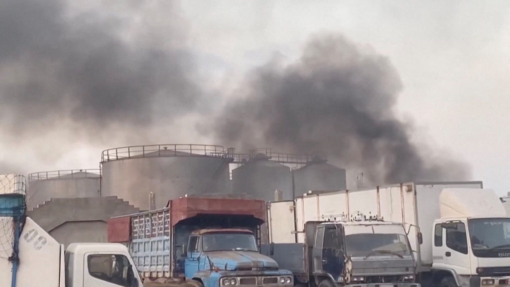 Smoke rises in Yemeni port of Mukalla following Saudi-led coalition strike on military shipments