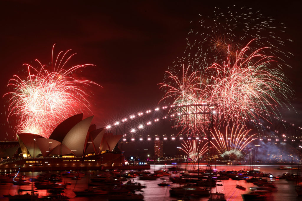 Fireworks explode over Sydney Harbour Bridge at 9 p.m. during New Year's Eve celebrations, in Sydney