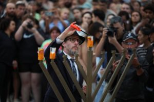 People pay respects at Bondi Pavilion to victims of a shooting during a Jewish holiday celebration at Bondi Beach, in Sydney