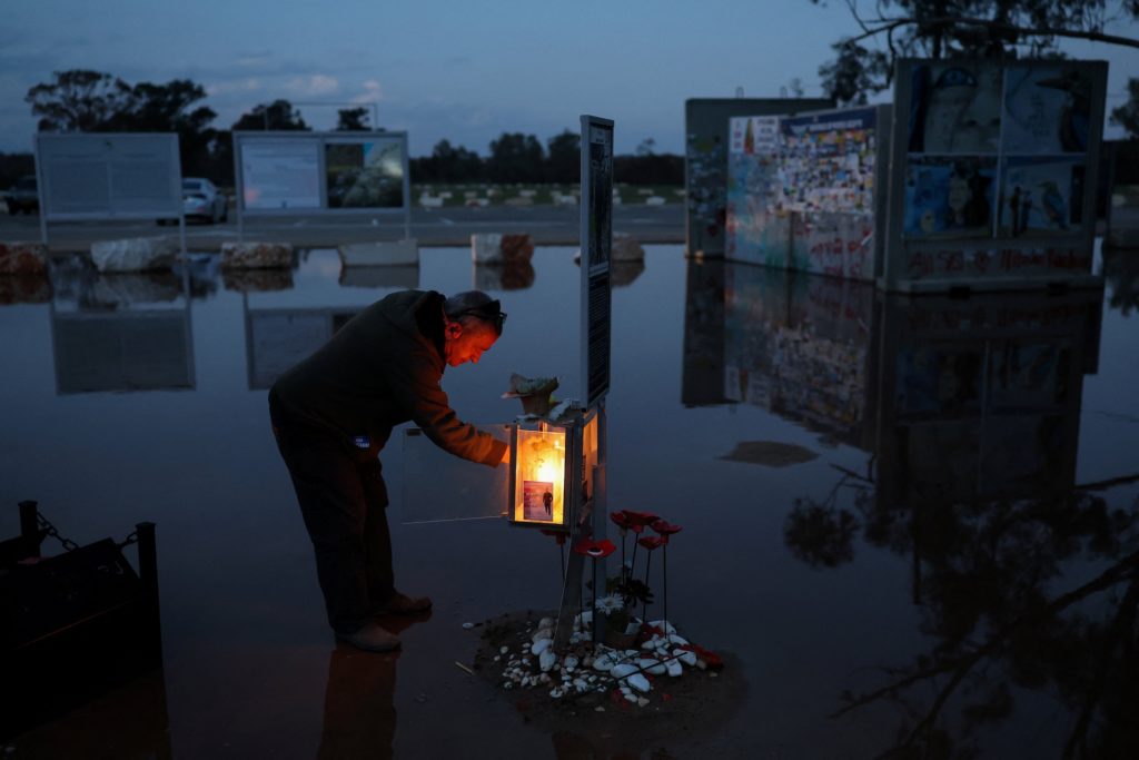 Lighting of the menorah on the third night of the Jewish holiday of Hanukkah at the site of the Nova festival, in Reim