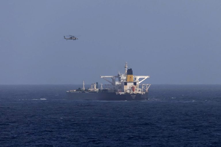 U.S. military helicopter flies over the Panama-flagged Centuries, which was intercepted by the U.S. Coast Guard