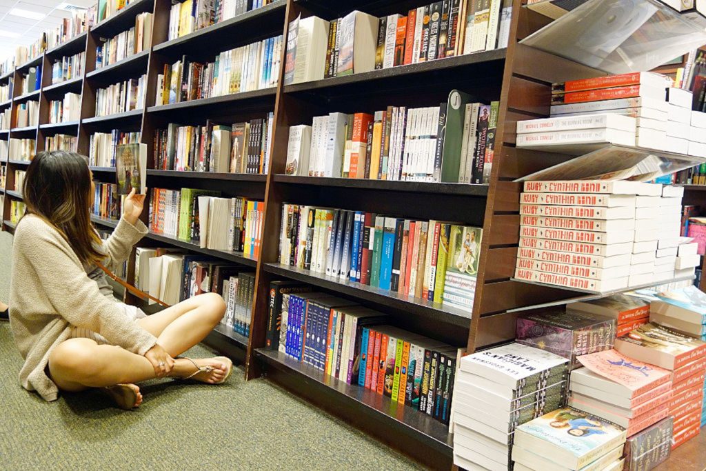 Woman Looking at Books in Bookstore, Boston, Massachusetts, United States