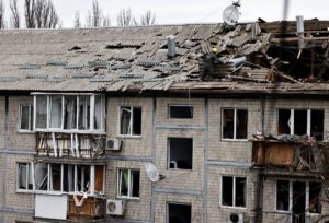 Emergency responders work at the site of a Russian drone strike on an apartment building, in Kyiv