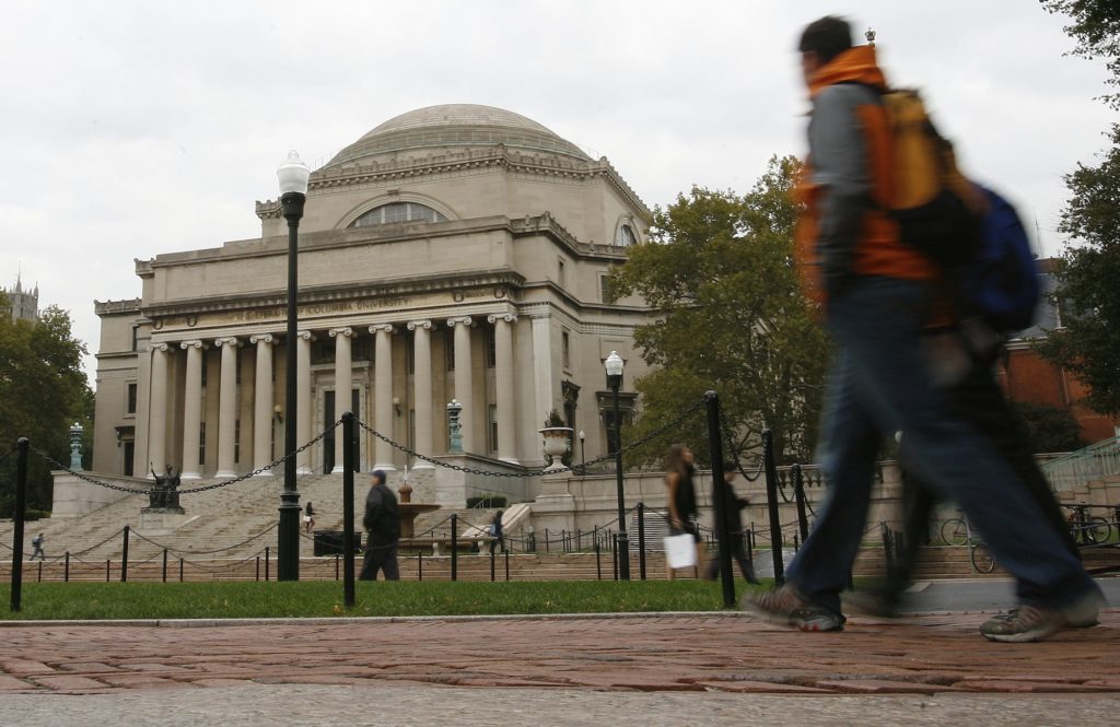 Students walk across the campus of Columbia University in New York