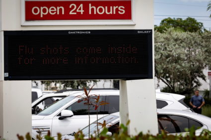 A sign advertises vaccine shots in Miami