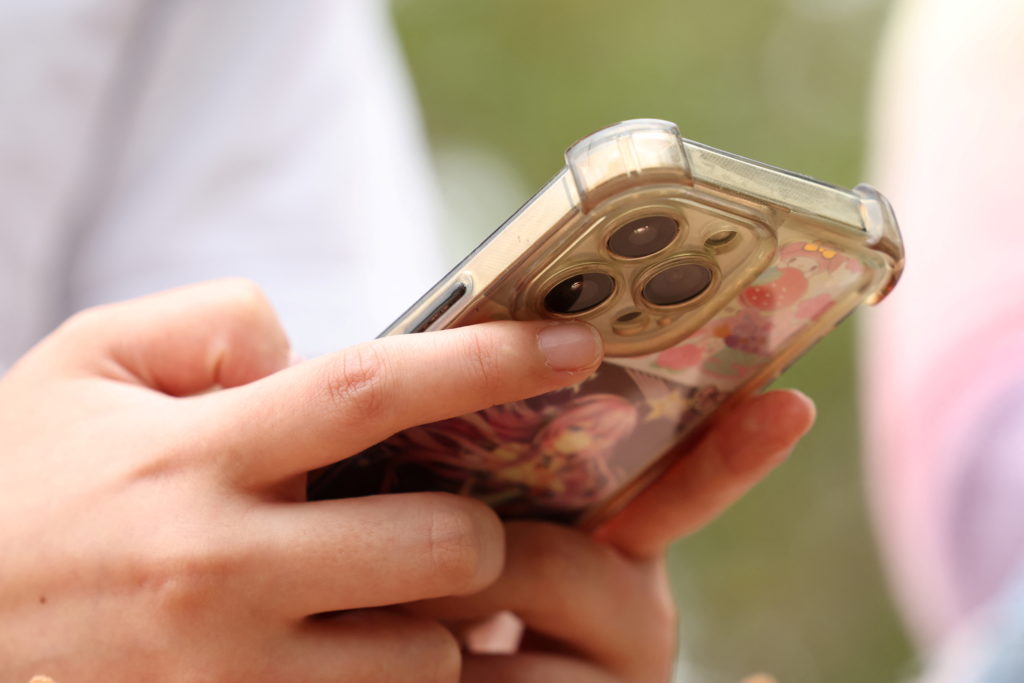 Teens discuss Australia's social media ban for under-16s, set to take effect December 10, in Sydney