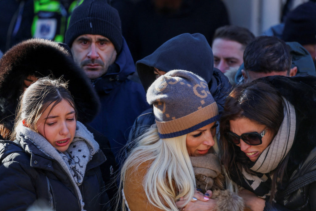 Mourners march in silence to honor victims of deadly Swiss Alpine bar fire | PBS News