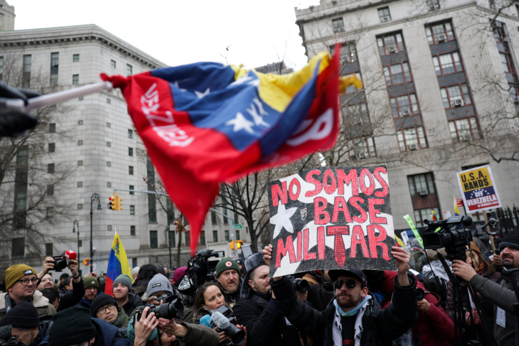 People protest against U.S. strikes against Venezuela and the capture of Venezuelan President Nicolas Maduro, in New York ...