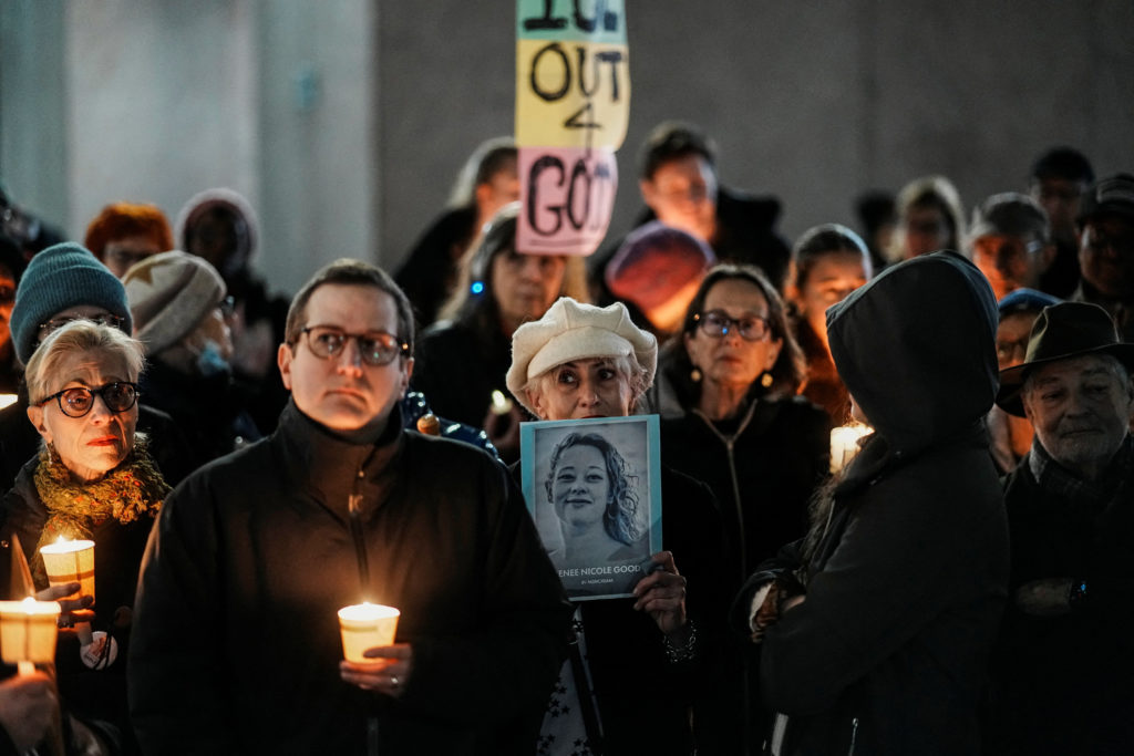 People take part in a vigil for Renee Nicole Good in New York