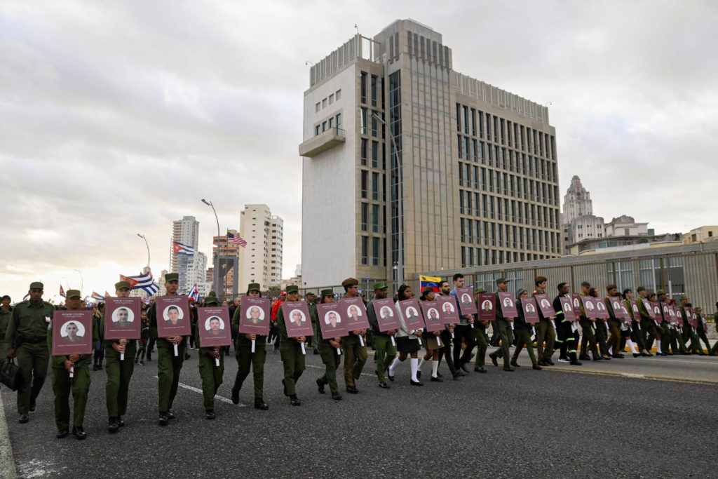 Cubans march outside U.S. embassy for soldiers killed in US attack on Venezuela, in Havana
