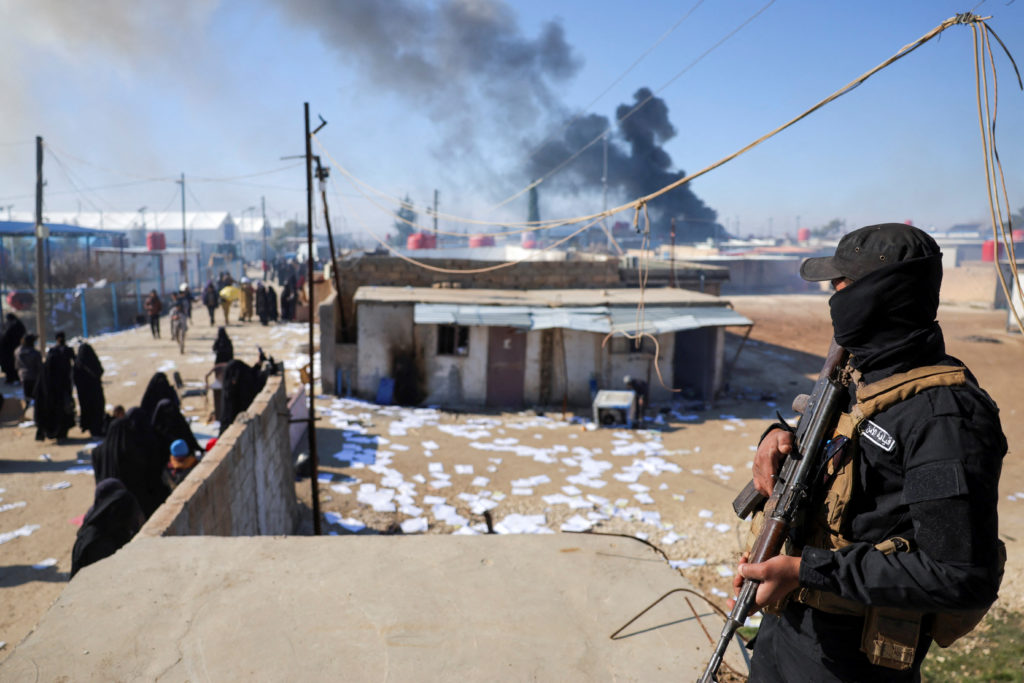 Detainees gather at al-Hol camp after the Syrian government took control of it, in Hasaka
